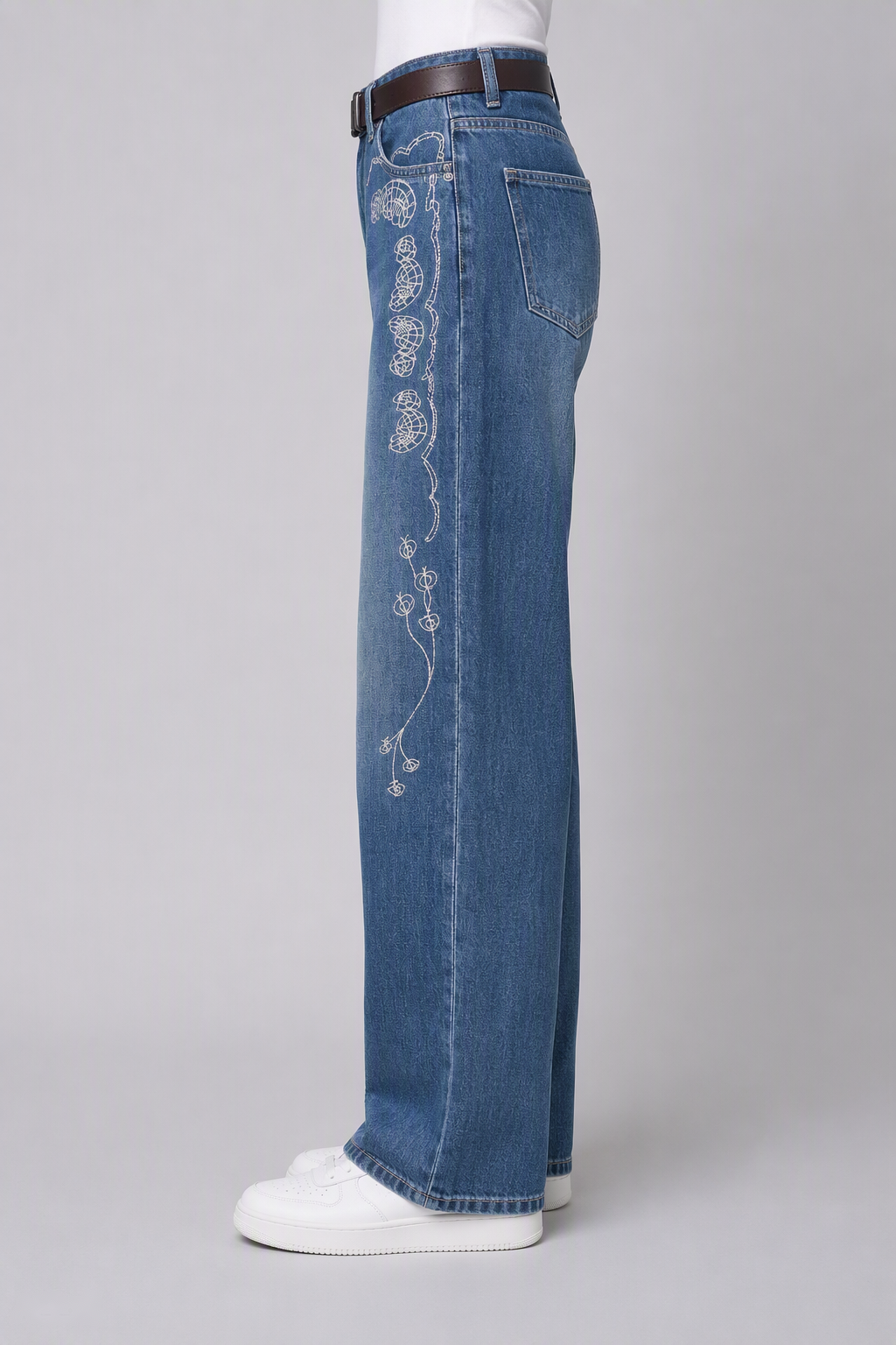 Model side view — Floral-Embroidered Straight-Leg Jeans in Blue (Style QY88305)