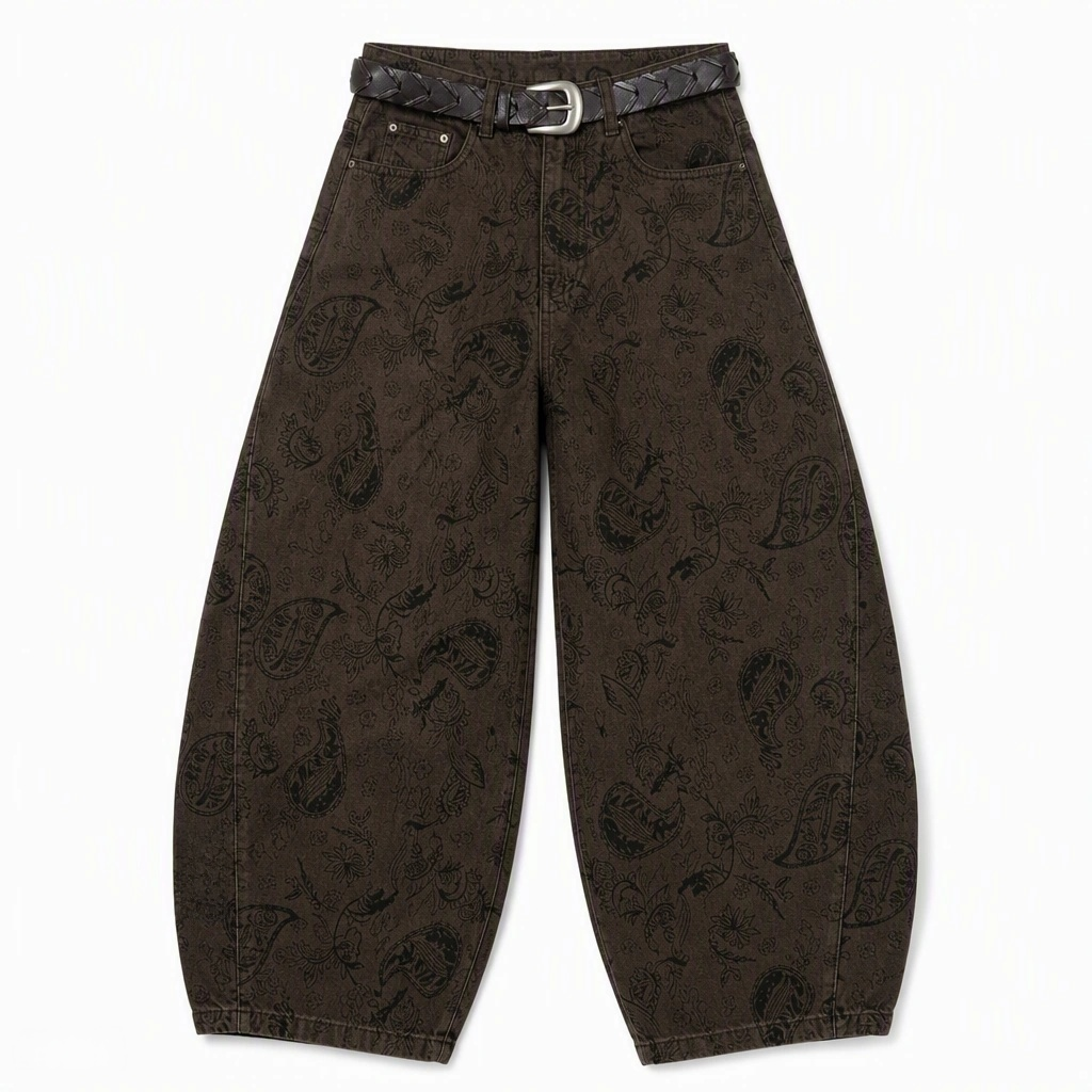 Flat-lay product photo of QAYQEY brown paisley-jacquard curved-leg jeans on a white background