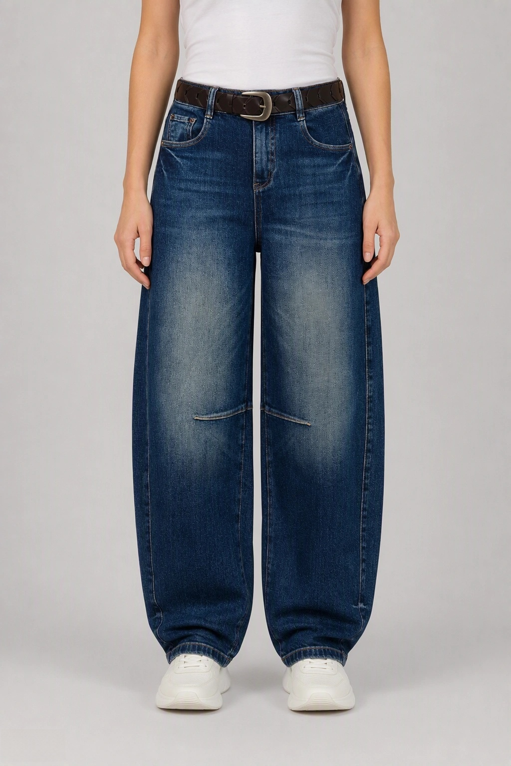 Front view of QAYQEY deep-blue knee-dart curved-leg jeans, waist-down crop on model