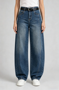 Front view of QAYQEY vintage-blue curved-leg jeans, waist-down crop on model