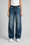 Front view of QAYQEY dark-blue knee-seam curved-leg jeans, waist-down crop on model