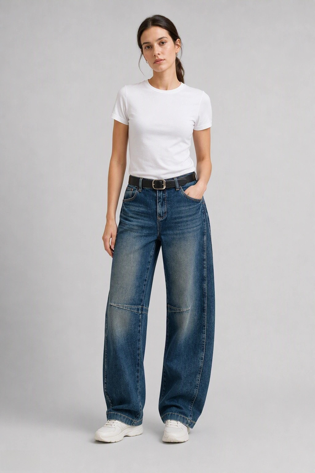 Full-body view of model wearing QAYQEY dark-blue knee-seam curved-leg jeans with a white tee and white sneakers