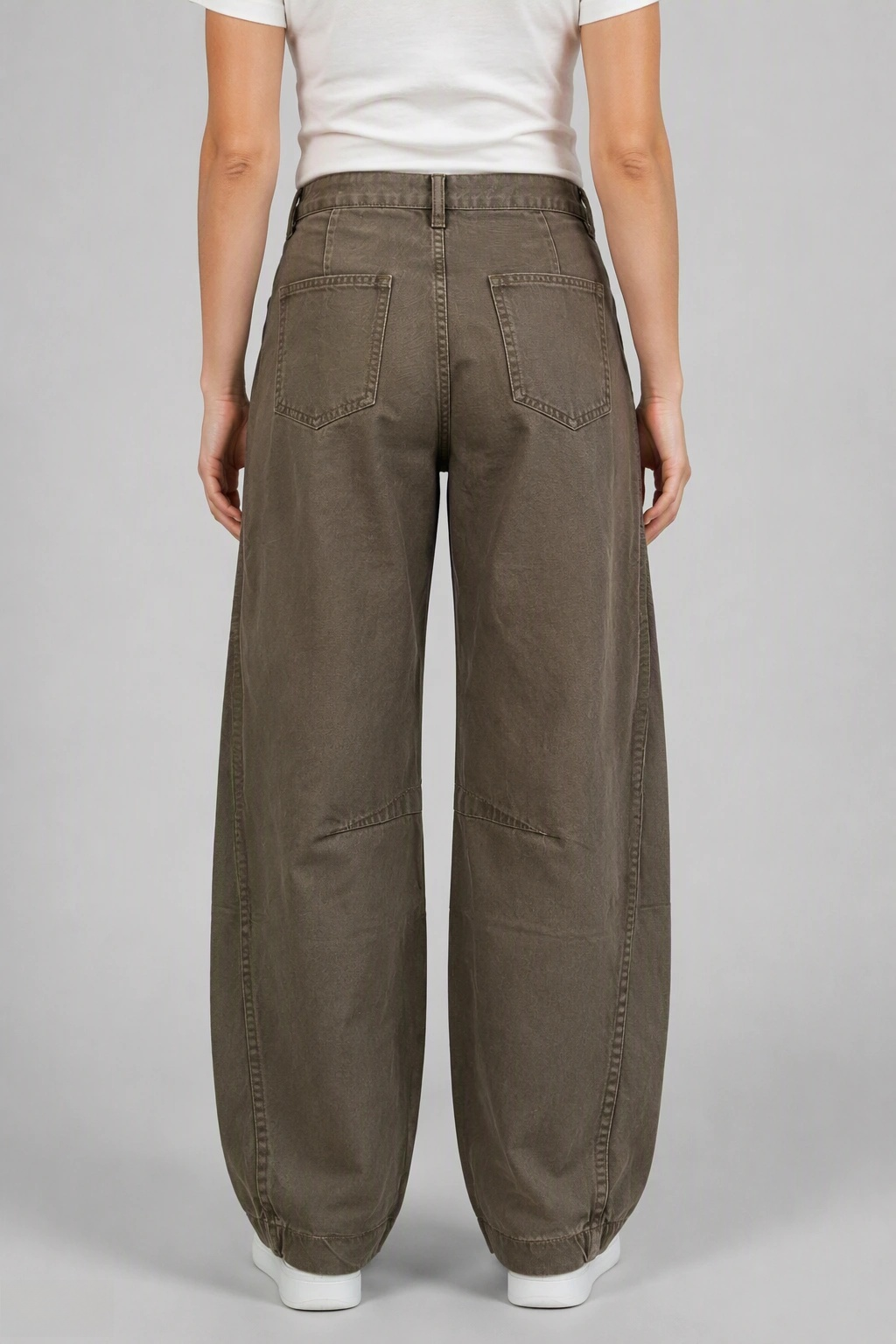 Back view of QAYQEY olive-green curved-leg jeans, waist-down crop on model