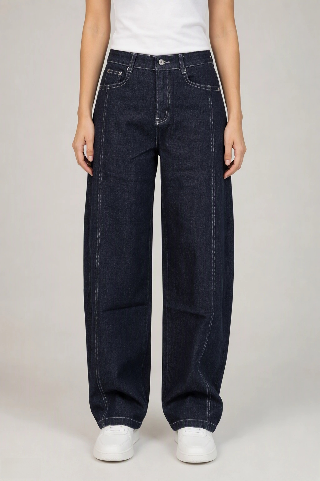 Front view of QAYQEY black-gray curved-leg jeans with contrast stitching, waist-down crop on model