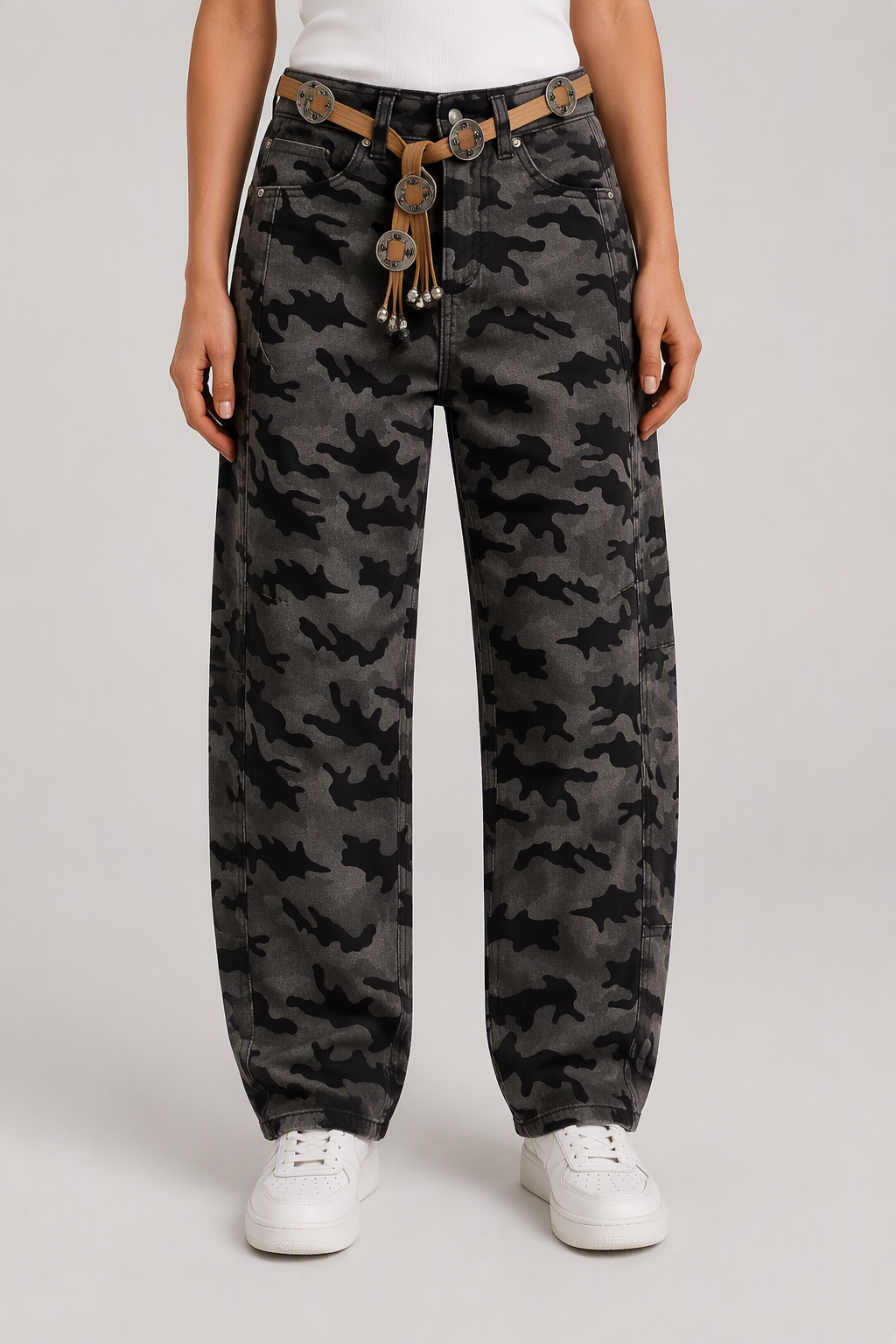 Front view of QAYQEY gray-black camouflage curved-leg jeans, waist-down crop on model