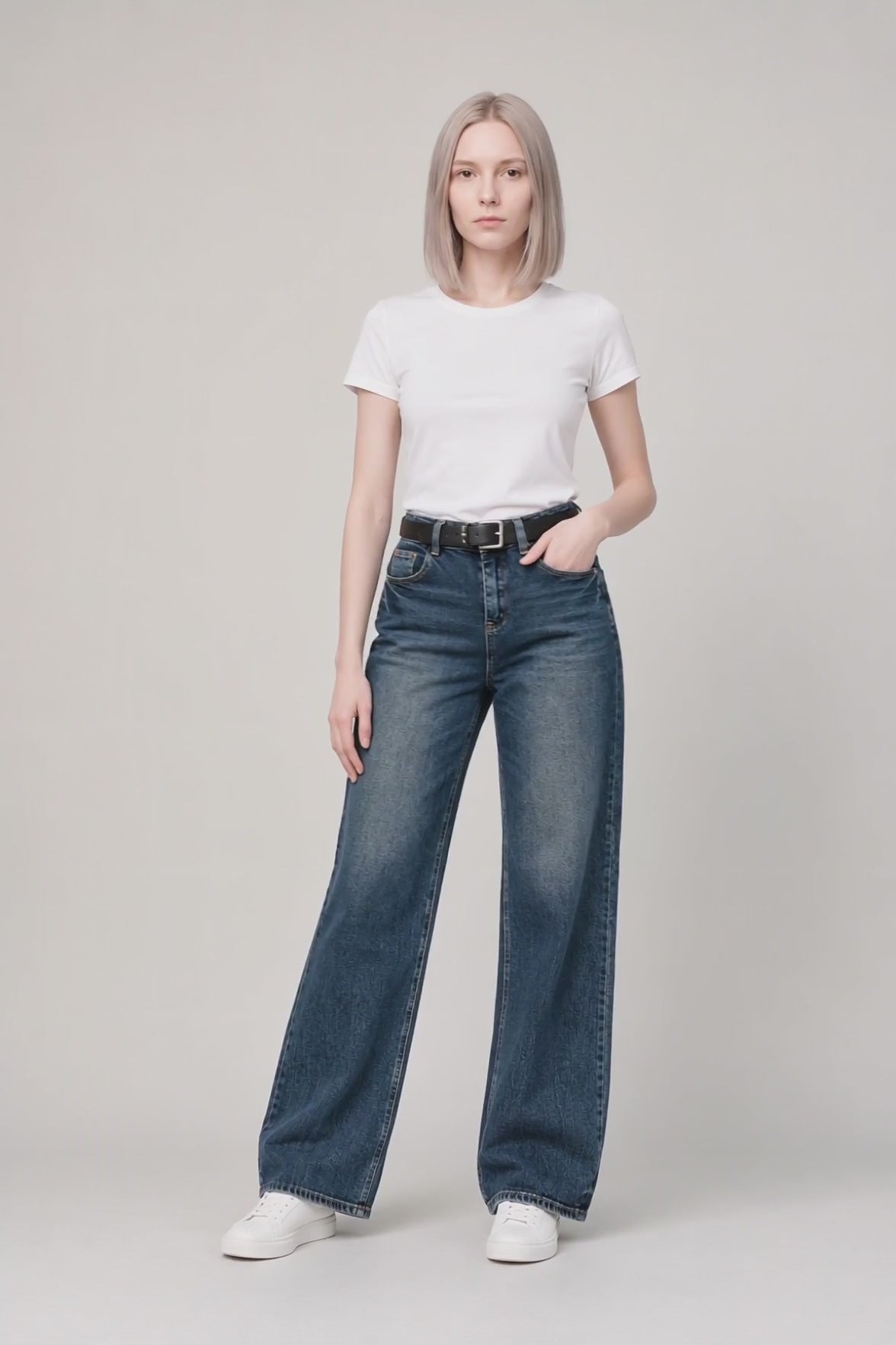Model wearing Flap-Pocket Straight-Leg Jeans in Deep Blue, walking and turning to show the straight-leg fit and flap pocket detailing.