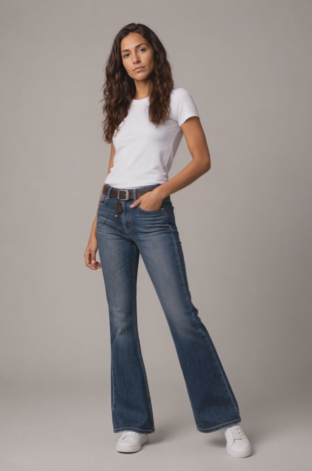 Model wearing Heavy-Wash Bootcut Jeans in Vintage Blue, walking and turning to show the bootcut fit and heavy-wash vintage finish.